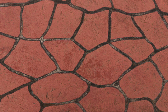 textured terracotta coloured patterned paving background