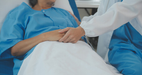 Young doctor is using a stethoscope listen to the heartbeat of the patient. Shot of a female doctor...