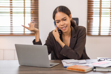 Corporate Communication. Asian Business woman using calculator and laptop for doing math finance, Asian Businesswoman Talking On Mobile Phone Working On Laptop In Modern Office. Free Space