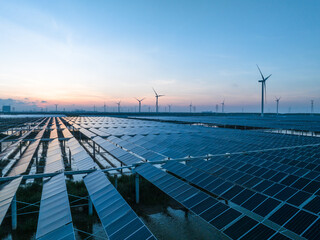 solar power panels and wind turbines on beach © zhu difeng