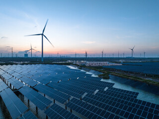 Solar power plant and Windmills aerial view at sunset. Renewable energy. Green tech. - 634259496