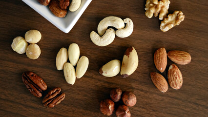 Mixed nuts and dried fruits on the table generative ai