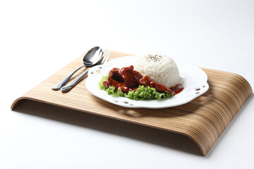 stir fried fresh pork ribs, fish, chicken meat in sweet and sour ketchup tomato sauce with jasmine rice and lettuce on wood tray white background asian chef halal food restaurant banquet cafe menu