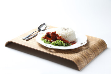 stir fried fresh pork ribs, fish, chicken meat in sweet and sour ketchup tomato sauce with jasmine rice and lettuce on wood tray white background asian chef halal food restaurant banquet cafe menu