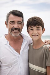 Fototapeta premium portrait of a boy and his father at the beach