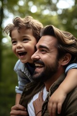 Fototapeta premium shot of a young father and son having fun together outdoors