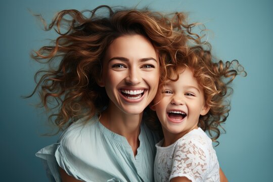 Beautiful Portrait Of A Mother And Her Little Child Making Faces, Light Blue Background, Studio Photos. Created By Generative AI Technology.