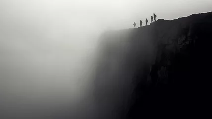 Fotobehang black and white photo cliff in the mountains in a foggy abyss landscape. © kichigin19