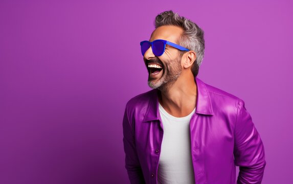 Happy ultra young handsome man, who is smiling and laughing, wearing bright clothes. Bright solid purple background. created by generative AI technology.