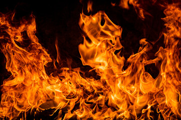 Fire blaze flames on black background. Fire burn flame isolated, abstract texture. Flaming explosion effect with burning fire.