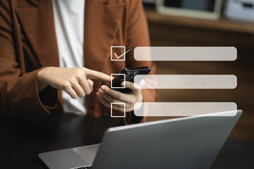 Business performance checklist concept, businessman using smartphone and laptop doing online checklist survey, filling out digital form checklist.
