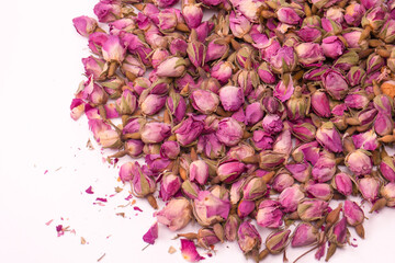 Dry tea roses isolated on white background.