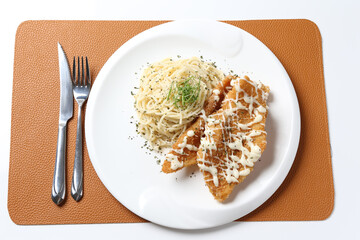 deep fried crispy fish fillet chips with fried egg, French fries, coleslaw salad, in tartar sauce carbonara pasta on brown leather white background western chef halal food restaurant banquet menu cafe