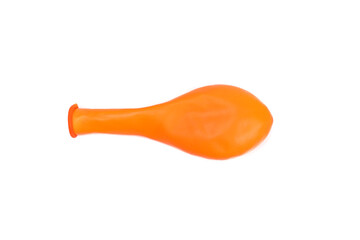Orange unblown balloon isolated on white