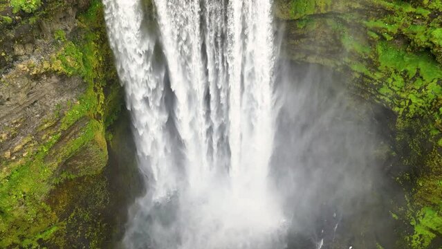 4K aerial video of Skogafoss waterfall. South Iceland. Epic Drone Shot Mountain Waterfall. Slow motion shot