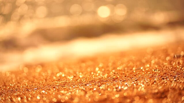 Bokeh abstract sea background. A summer ocean sunset sea background with small waves on the water's surface in motion blur and bokeh lights from sunrise, creating an abstract nature scene
