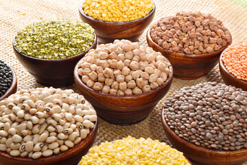 Variety of uncooked legumes and lentils in bowl
