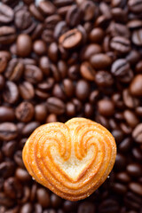 Closeup of heart shape biscuit, coffee date concept