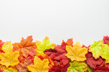 Fall composition close up. Frame made of autumn leaves isolated on white background. Top view with...