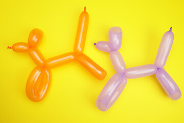 toy dog from a balloon on a yellow background, the concept of children's celebrations