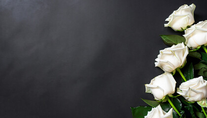 Fresh, white roses on black, dark background. Condolence card. Empty place for emotional,...