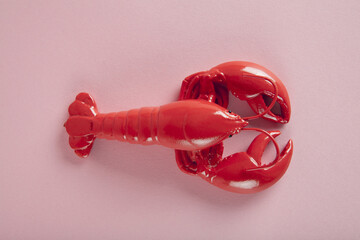 a red lobster on a pink background