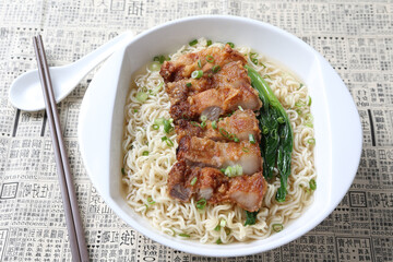 cook Japanese instant noodle mee soup with chicken chop cutlet and vegetables on bowl chopstick on white vintage newspaper background asian chef halal food restaurant banquet menu