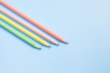 school supplies, pencils on a blue background, back to school