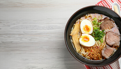 Bowl of delicious ramen with meat and egg on violet table, top view with space for text. Noodle soup