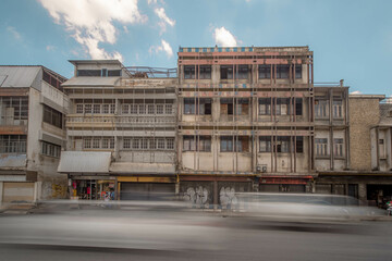 Fototapeta na wymiar LOPBURI, THAILAND - JULY 29, 2020 : Long exposure of the vehicle in front of the architecture, Thailand.