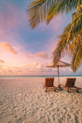 Tropical sunset beach panorama as summer relax landscape. Swing on coconut palm tree hanging over sandy coast calm sea, carefree beach. Amazing panoramic summer vacation. Sun rays seascape relax sky