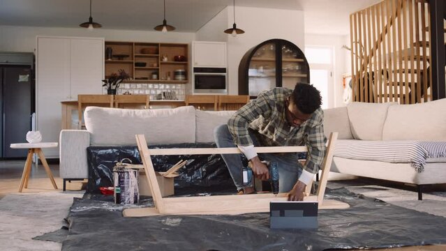 Black Man Assembling a DIY Wooden Table