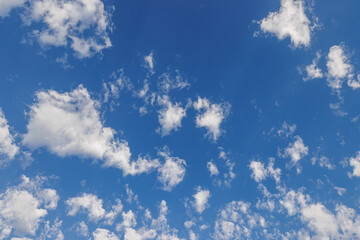 Cloudscape. Blue sky and white clouds, wide panorama. Sunny heaven and Earth environment concept. Tranquil relax serene sunshine blue skies cloudy panoramic background