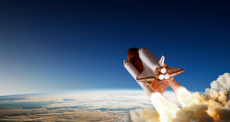 Spaceship takes off into the night sky on a mission. Elements of this image furnished by NASA