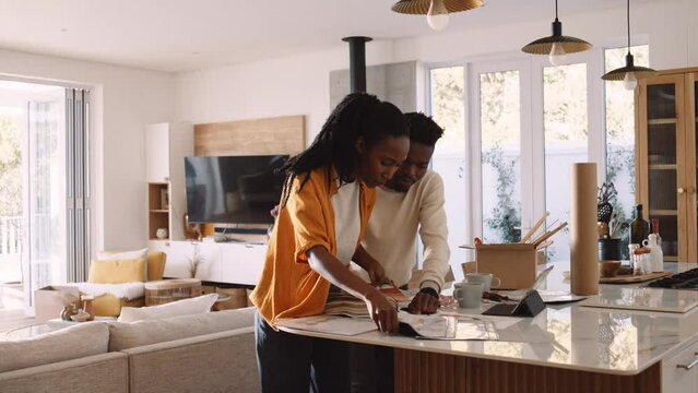 A Black Couple Arguing At a Counter Over Renovation Plans