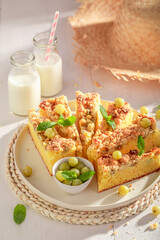 Sweet gooseberry butter cake served with milk in bottle.