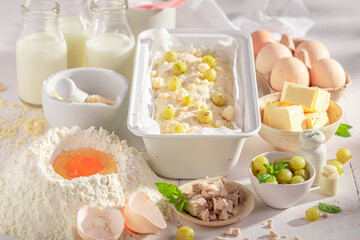 Homemade gooseberry yeast cake with ingredients for the dough.