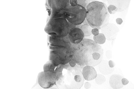 A black and white paintography portrait of a man and painted circles