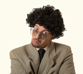 Stylish handsome young curly man and sunglasses has good mood