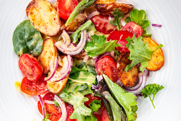 potato salad baked vegetable potato, tomato, onion, salad leaves vegetables food healthy meal food snack on the table copy space food background rustic top view 