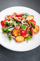 potato salad baked vegetable potato, tomato, onion, salad leaves vegetables food healthy meal food snack on the table copy space food background rustic top view 