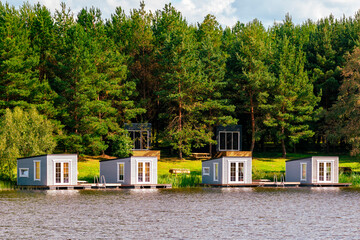 Vacation rental forest lodge countryside cabins by the lake for holidays in the nature