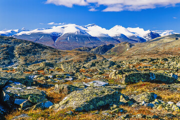 Rocky terrain with snow capped mountain peaks in the north of Scandinavia