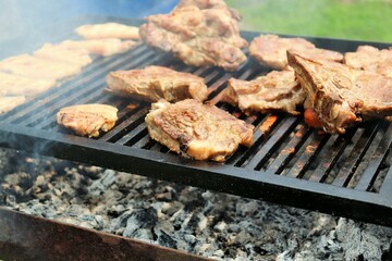 Pork chop on a steaming grill, well done