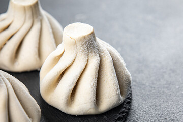 khinkali meat filling dumpling frozen semi finished cuisine food meal food snack on the table copy space food background rustic top view