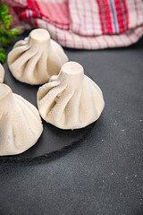 khinkali meat filling dumpling frozen semi finished cuisine food meal food snack on the table copy space food background rustic top view