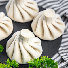 khinkali meat filling dumpling frozen semi finished cuisine food meal food snack on the table copy space food background rustic top view