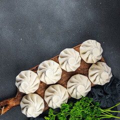 khinkali meat filling dumpling frozen semi finished cuisine food meal food snack on the table copy space food background rustic top view