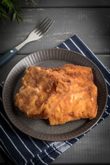 Two fried cod fillet pieces.