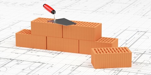 Stack of red brick stones with trowel on top on architectural building construction drawing plans background, construction or masonry or industry concept